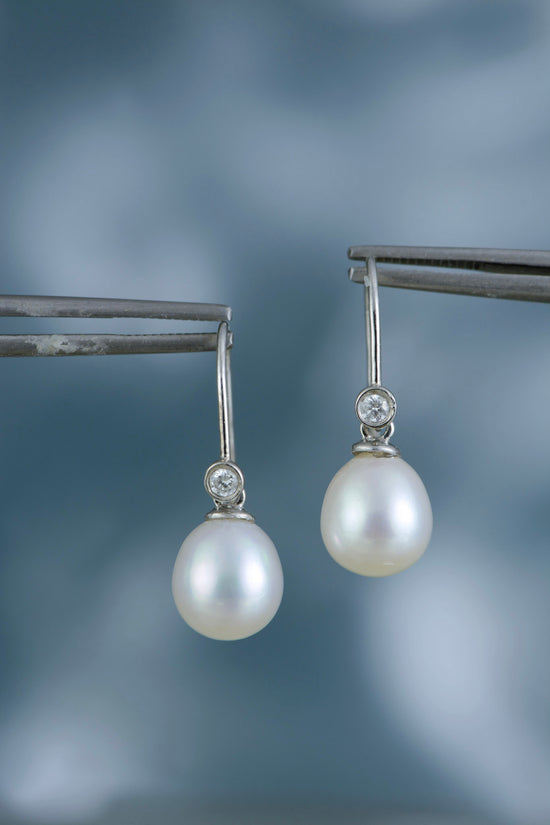 White gold pearl drop earrings with diamonds